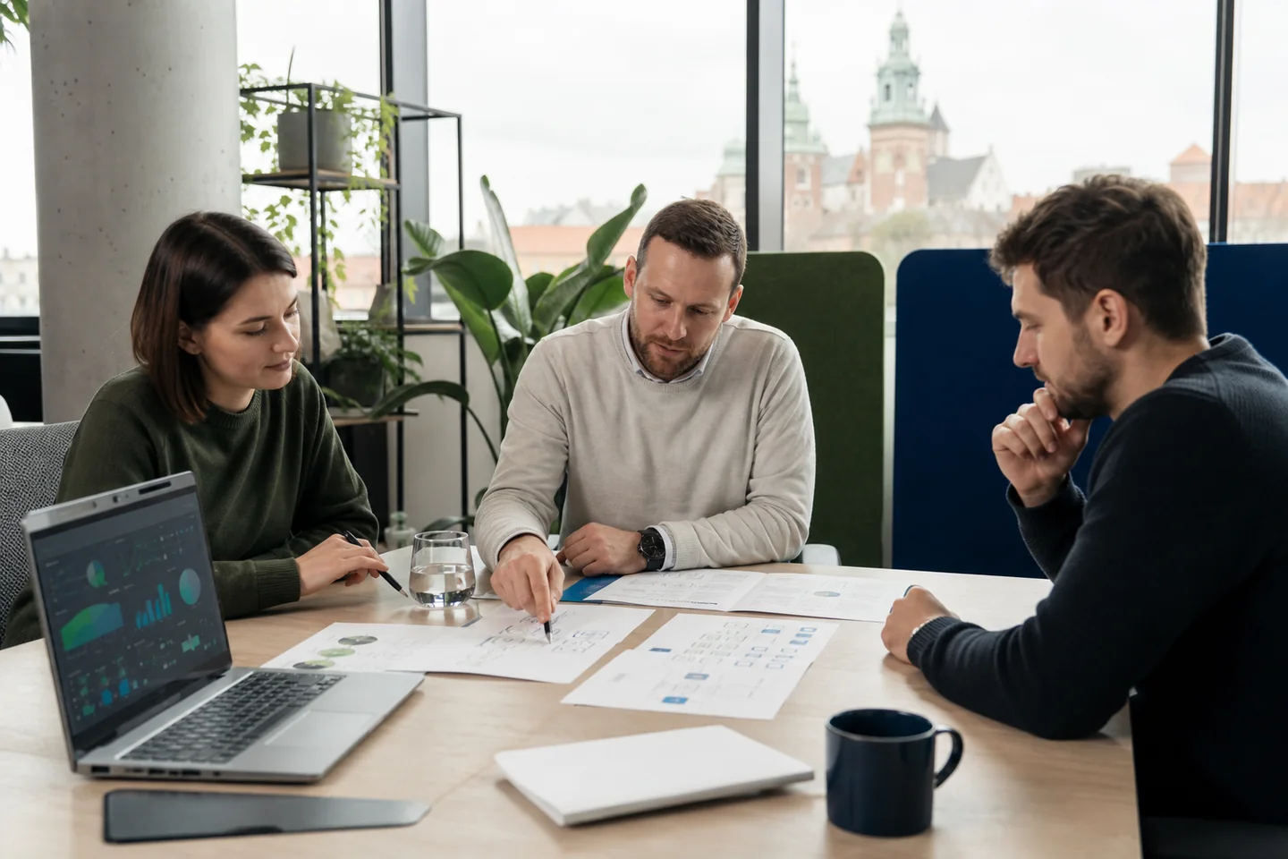 IT engineers reviewing an implementation plan and service report